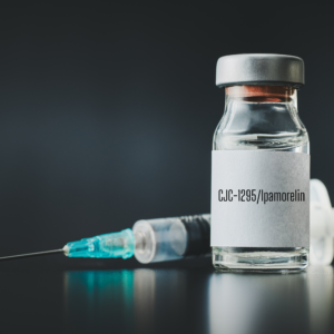 Close-up image of a vial labeled Tesamorelin, a peptide therapy used to stimulate the body’s natural growth hormone production.